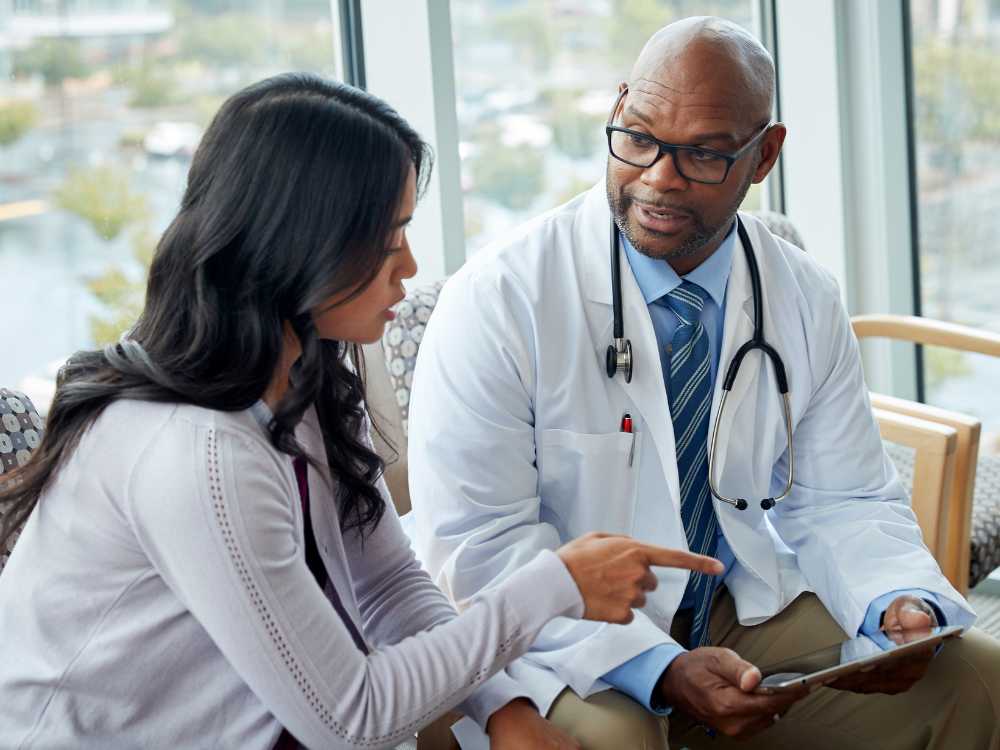 Doctor patient healthcare professional discussing treatment care analysis statistics