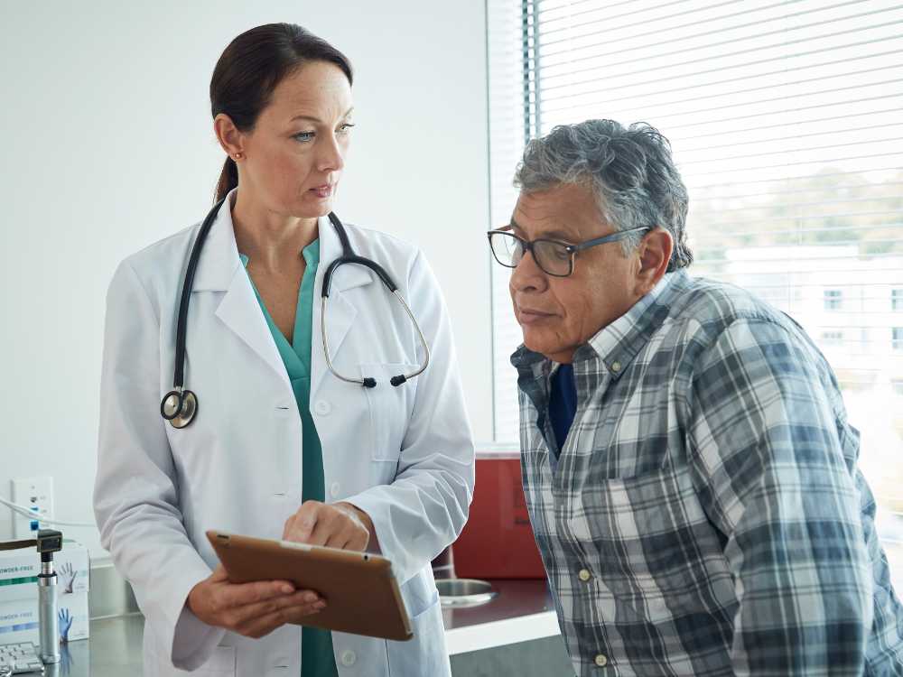 Doctor with Patient Explaning Care Treatment and Diagnosis Plan
